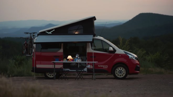 camper van at dusk with mountainous background