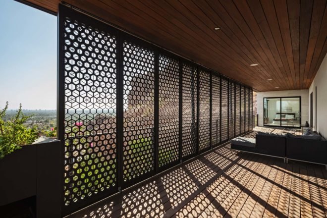 steel screens enclosing a wooden patio