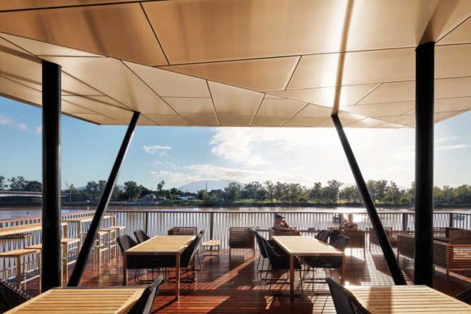 Covered outdoor dining area overlooking the lake