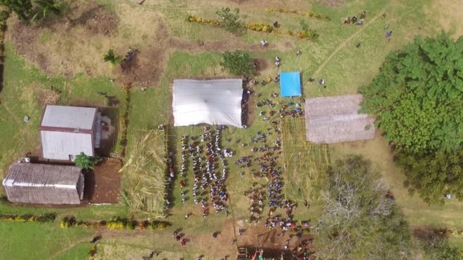 aerial view of school in a box with people outside