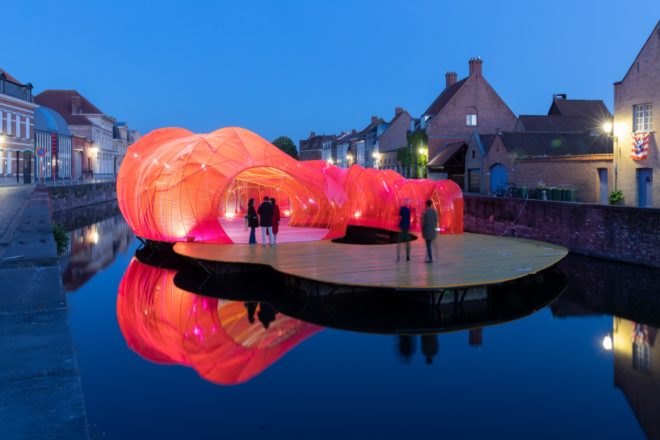 people walking on pavilion at night