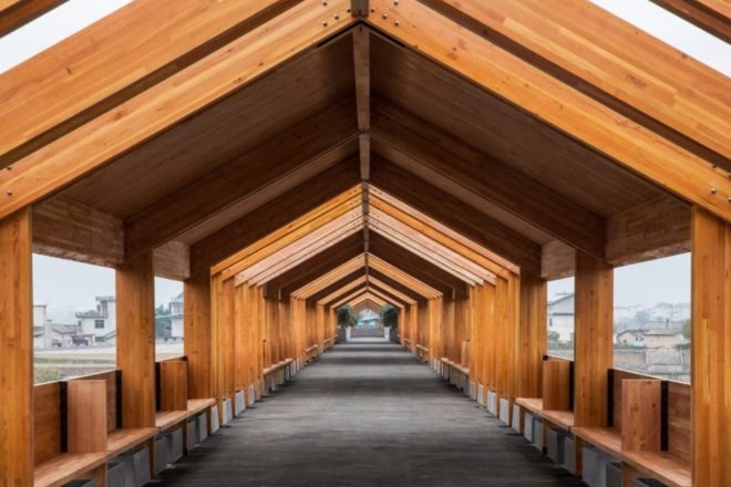 looking through a wood-roofed bridge