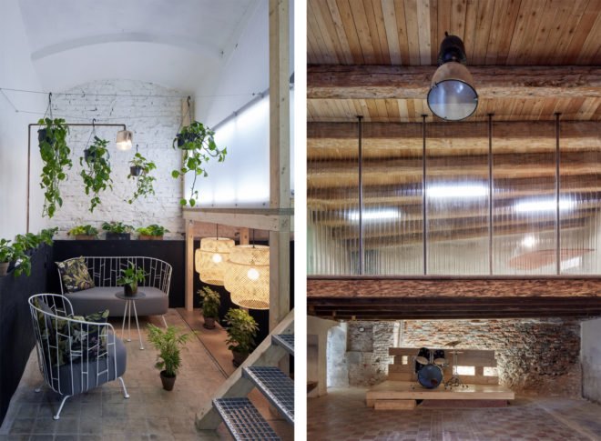 Pn the left, meeting area with couch and chair and several plants. On the right, lofted space above an entertaining stage with a drum set.