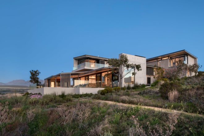 exterior of modern home on grassy slope
