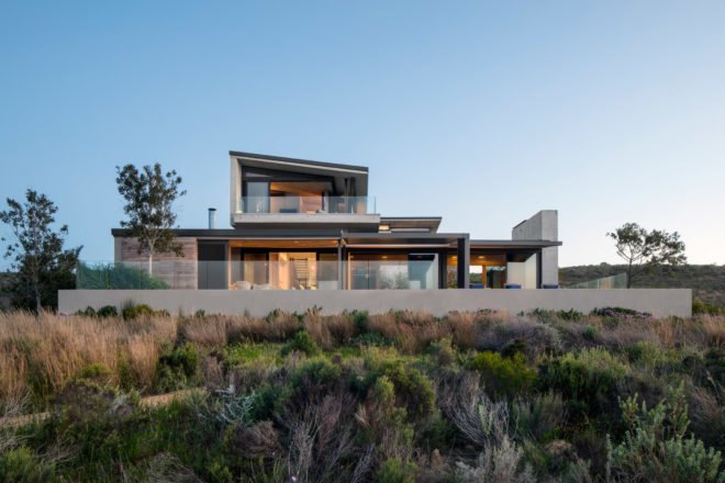 exterior of modern home on grassy slope
