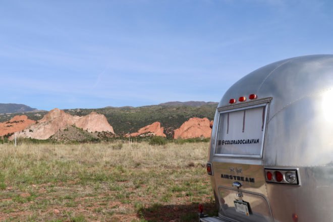Exterior image of the back of the caravan with a Colorado Caravan decal on the window