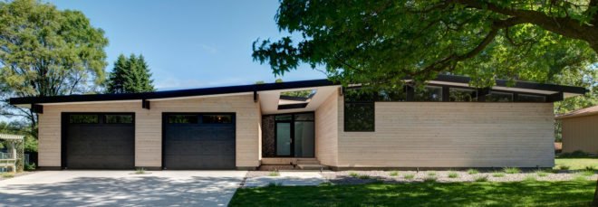 Light wood one-story home with two garages