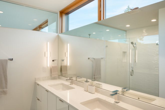 Bathroom with all white decoration and windows at top