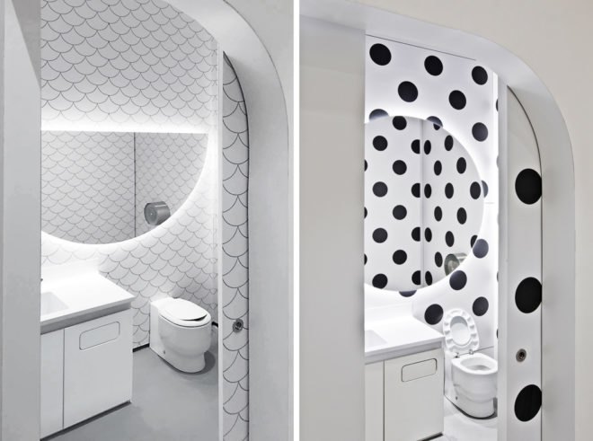 children bathrooms with scalloped tiles and black and white polka dot wallpaper