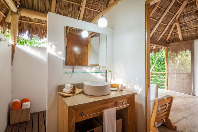 Bathroom sink and counter space just to the side of the open patio
