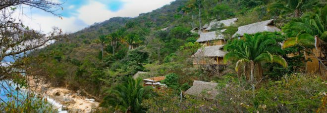 Several resort cabins on the mountainside