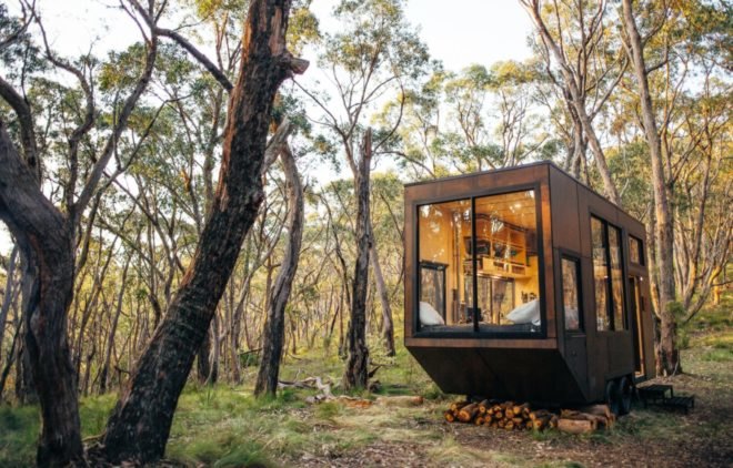 tiny wooden cabin with large front window