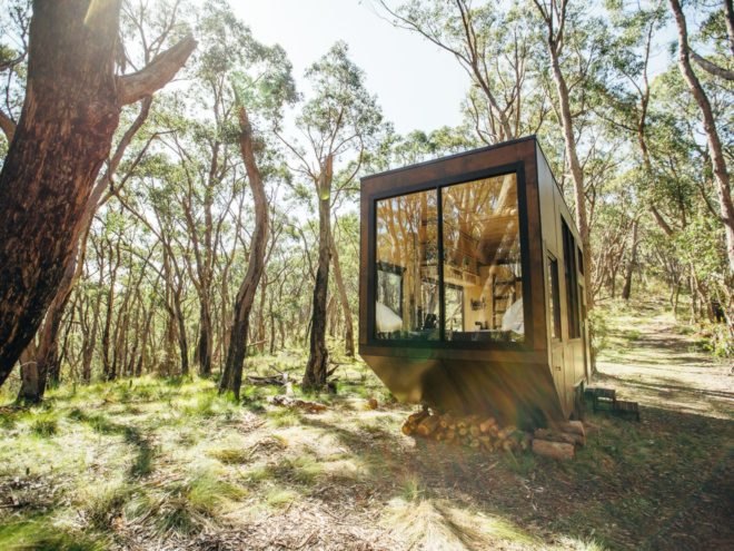 tiny wooden cabin with large front window