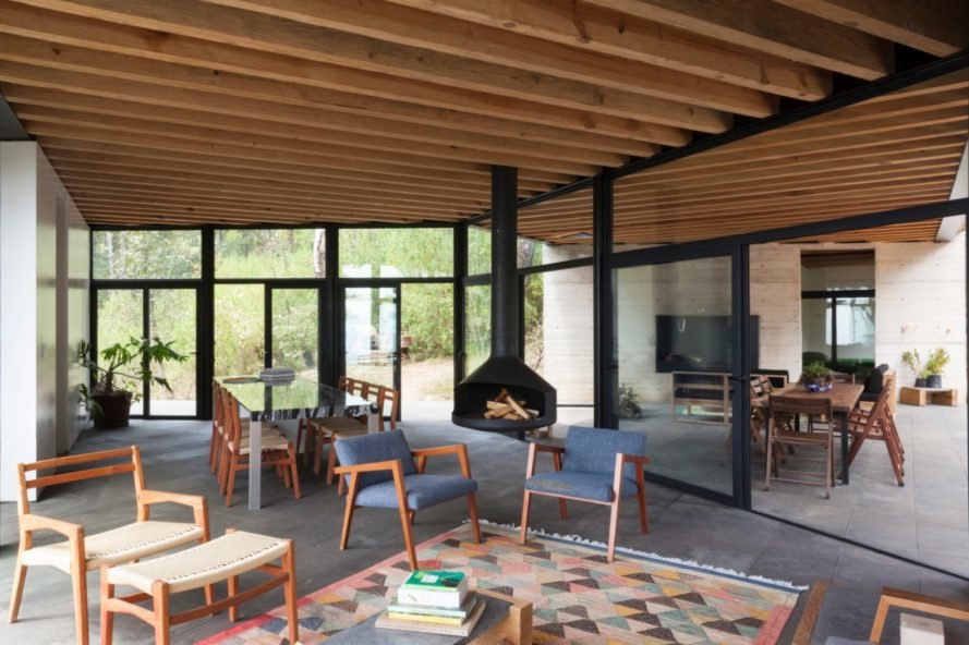an interior living spac with floor to ceiling windows