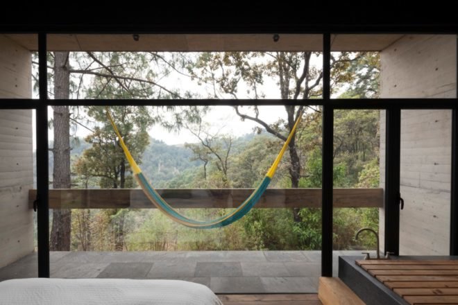 a bedroom with outdoor balcony with a hammock