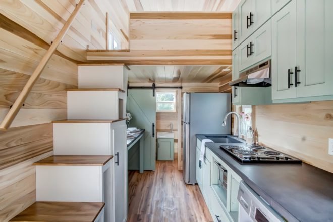 interior shot of kitchen and stairs leading up to second floor