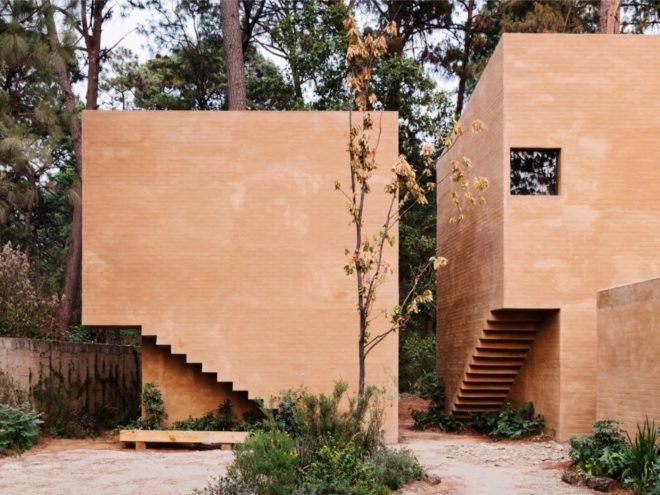 light pink brick homes with the underside of the indoor staircases imprinted into exterior