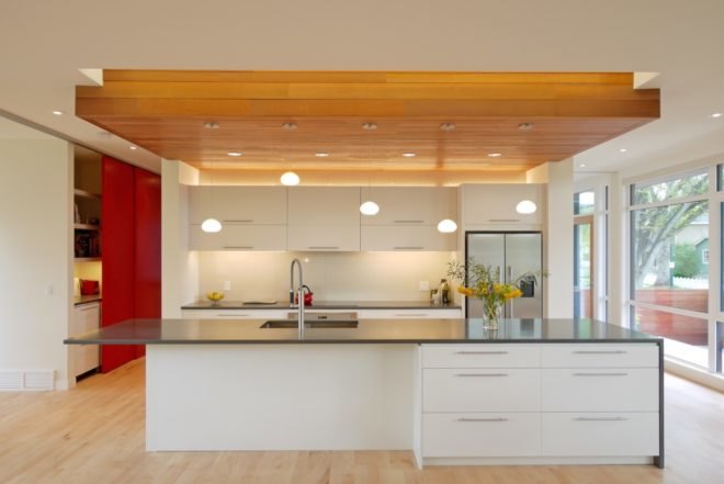 kitchen with wood ceiling and white cabinetry