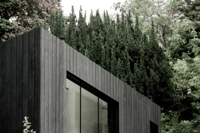 a slanted roof on a tiny cabin