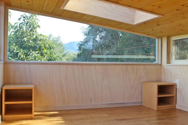 a wood-clad interior with horizontal window