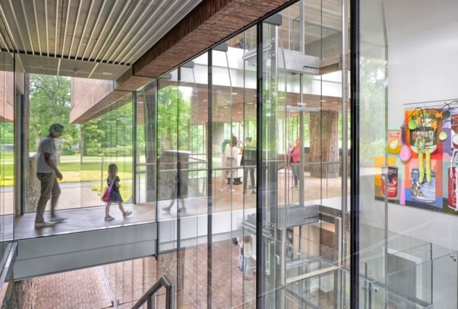 exhibition spaces visible through glass walls