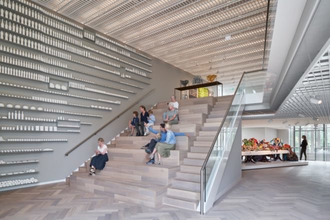 people relaxing on multipurpose stairway with seating in the middle