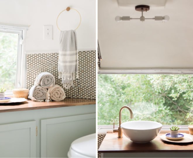 bathroom with green cabinets and counter sink