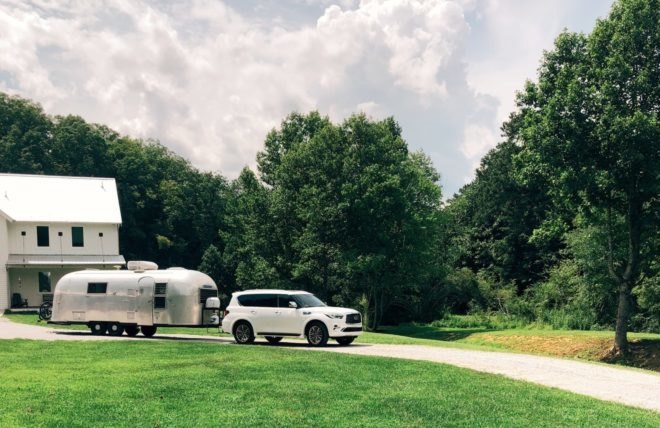 white SUV pulling an Airstream