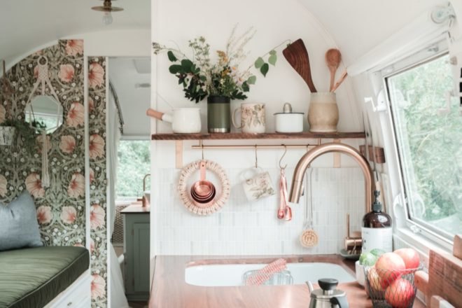small white kitchen with brass features