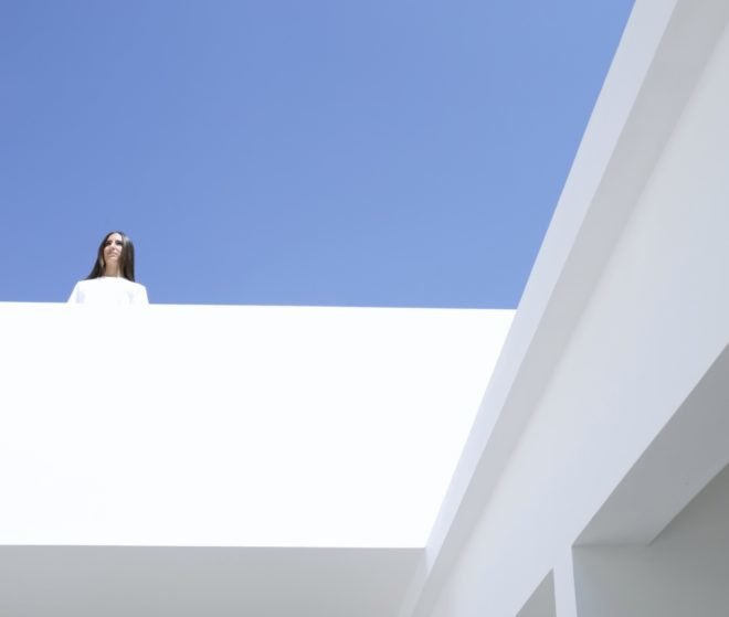 woman looking from the above eating areas on the upstairs terrace