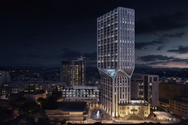 tall white twisting tower at night