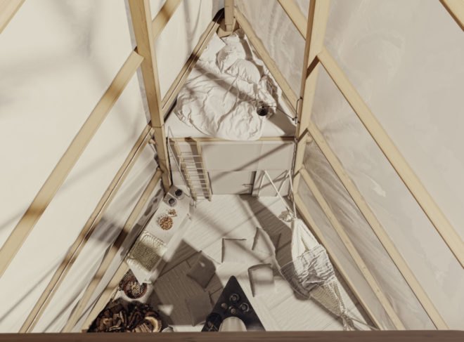 a triangular interior space with an elevated sleeping platform