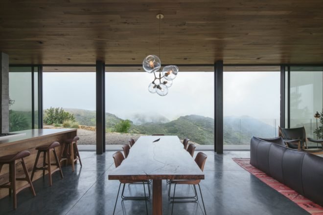 open plan dining area with glass wall