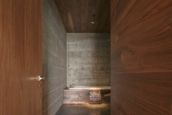 wood-paneled bathroom with tub