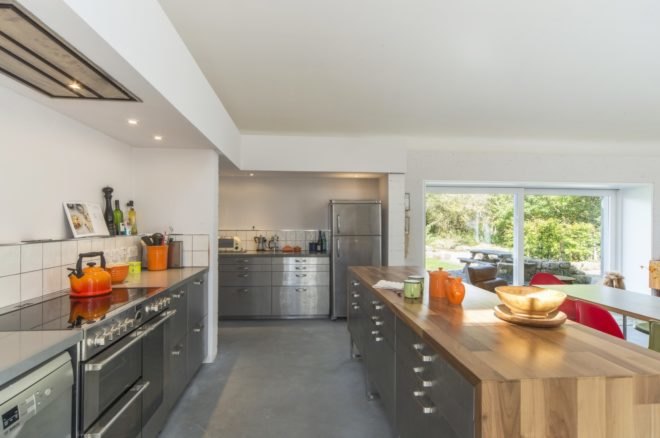 Kitchen with gray and blonde wood cabinetry
