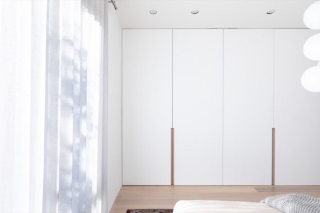 bedroom closets with white doors