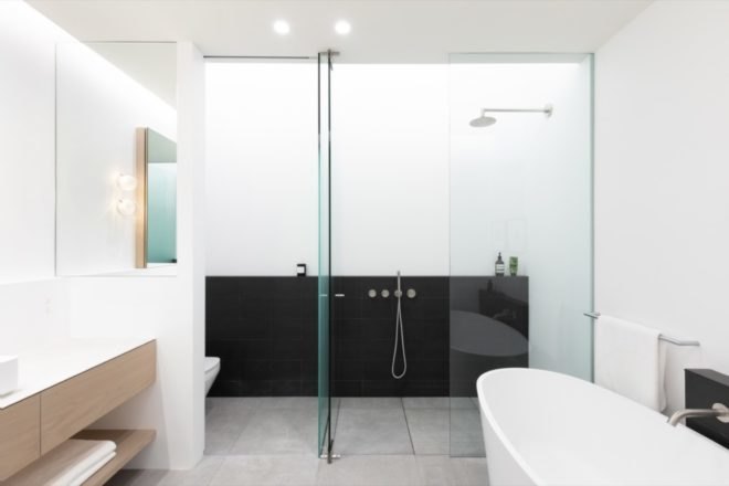 bathroom with standing tub and separate walk-in shower