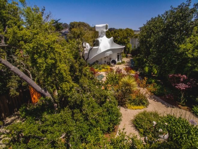 a white home on landscaped property