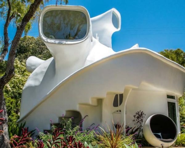 an all-white structure with a periscope-like lookout on the roof