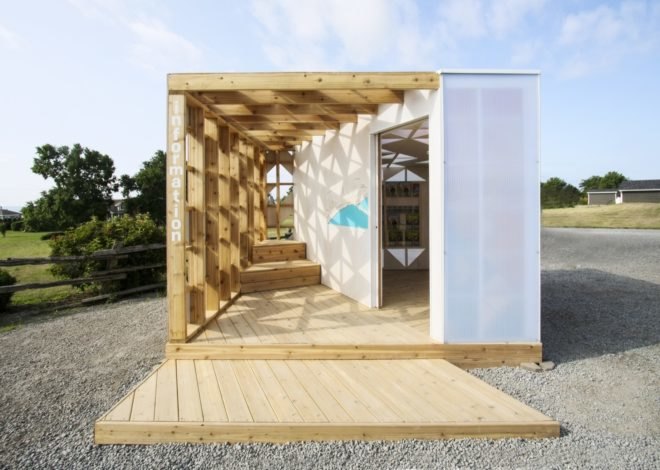front of a square wooden pavilion open to the air