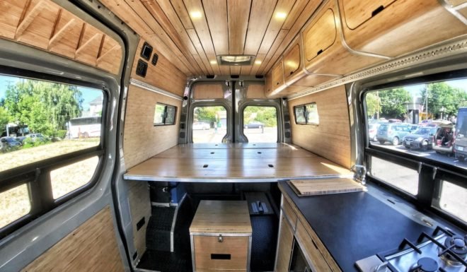 empty bed platform with storage space above, below and on the side
