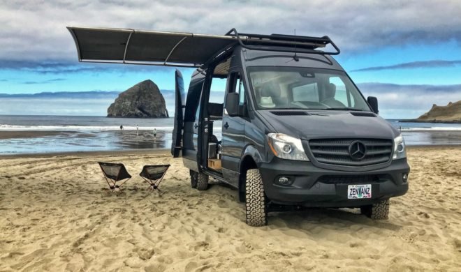 black van with side door open on the beach