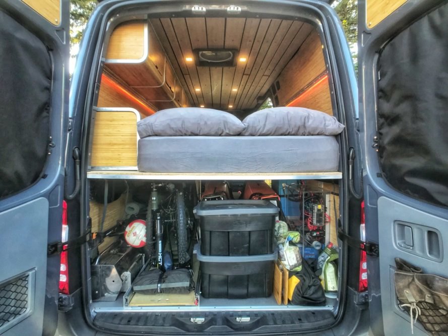 view of converted van with sleeping platform