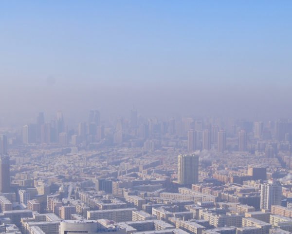 smog-covered skyline of Harbin City in China