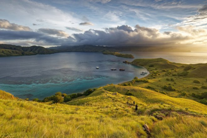 Aerial view of Komodo National Park with mountains and ocean at sunset