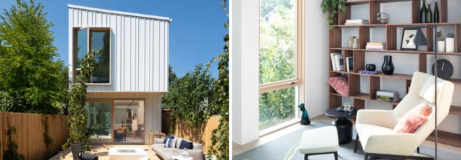 On the left, tall narrow white house. On the right, reading corner with modern chair and lamp, large glass window and several timber shelves holding books.