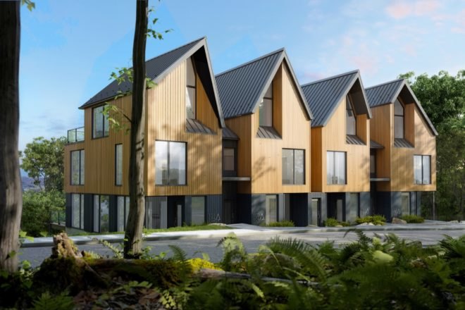 four connected structures with light wood exterior and gabled roofs