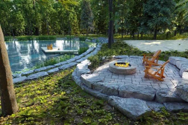 ourtoodr stone patio with wood chairs and firepit in front of human-made pond