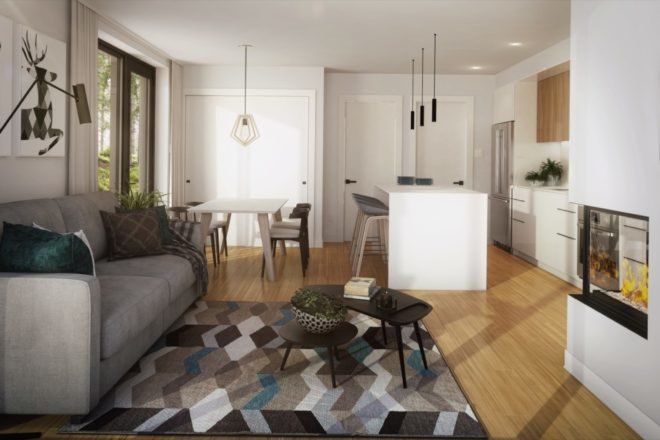 living space with light gray couch, patterned rug, curved black coffee table and white fireplace