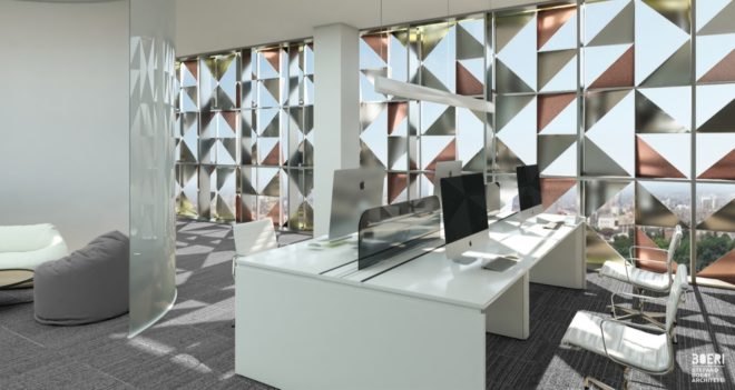 large white desks and chairs with a wall of glass featuring aluminum triangle patterns